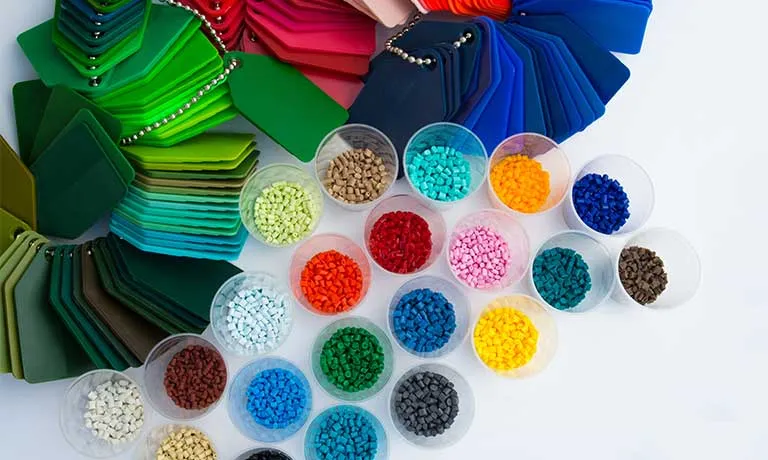 Several dyed plastic polymer granulates in laboratory